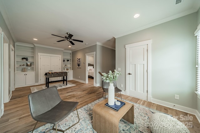 365 Delburg St, Davidson, NC 28036 - living room featuring crown molding, baseboards, a ceiling fan, recessed lighting, and light wood-style flooring
