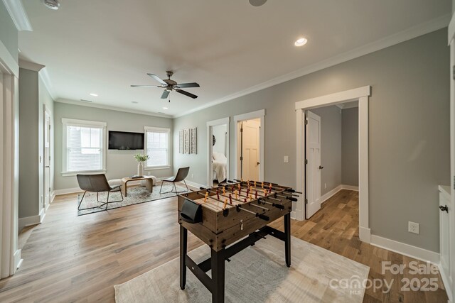365 Delburg St, Davidson, NC 28036 - game room featuring ornamental molding, ceiling fan, baseboards, light wood-style floors, and recessed lighting