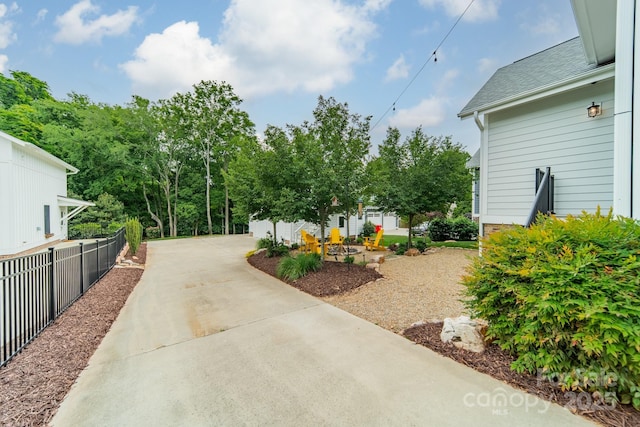 365 Delburg St, Davidson, NC 28036 - view of yard featuring fence and concrete driveway