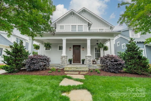 365 Delburg St, Davidson, NC 28036 - craftsman-style house featuring board and batten siding, a porch, and a front lawn