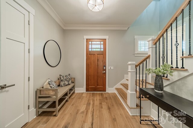 365 Delburg St, Davidson, NC 28036 - foyer with stairs, crown molding, light wood-type flooring, and baseboards