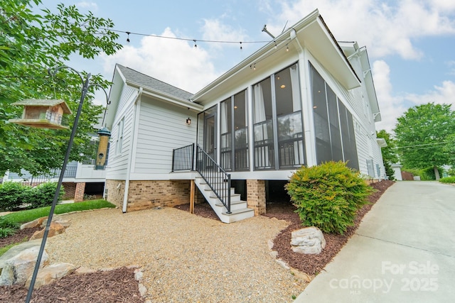 365 Delburg St, Davidson, NC 28036 - back of house featuring a sunroom and stairway