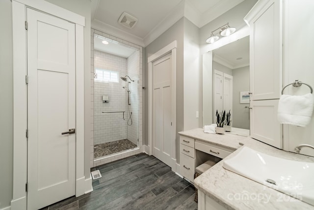 365 Delburg St, Davidson, NC 28036 - bathroom featuring ornamental molding, a stall shower, wood finished floors, and vanity