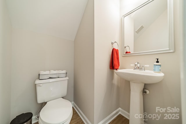 984 Park Slope Dr, Charlotte, NC 28209 - bathroom featuring toilet, wood finished floors, and baseboards
