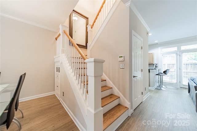 984 Park Slope Dr, Charlotte, NC 28209 - staircase with crown molding, wood finished floors, baseboards, and recessed lighting