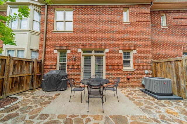 984 Park Slope Dr, Charlotte, NC 28209 - fenced backyard with area for grilling, central air condition unit, a patio, and outdoor dining space