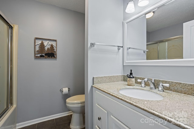 1201 Deermouse Way, Hendersonville, NC 28792 - full bathroom featuring tile patterned floors, toilet, vanity, baseboards, and a textured ceiling