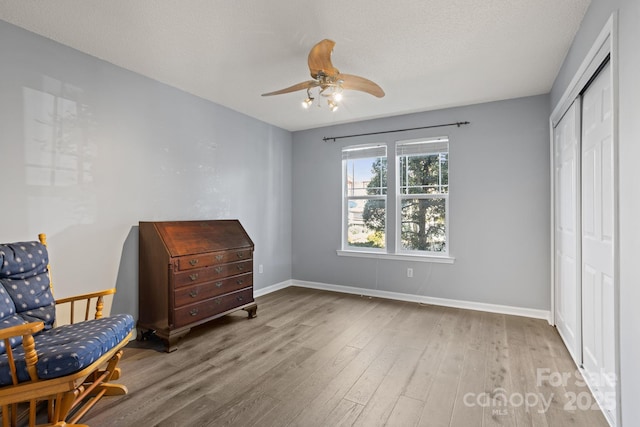 1201 Deermouse Way, Hendersonville, NC 28792 - living area with baseboards, a ceiling fan, and wood finished floors