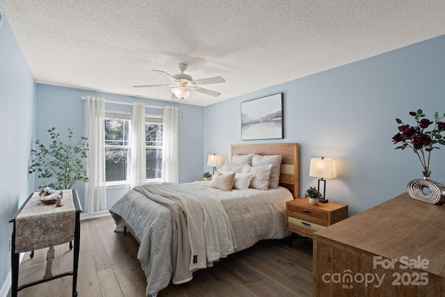 1201 Deermouse Way, Hendersonville, NC 28792 - bedroom with a ceiling fan, a textured ceiling, and dark wood-style flooring