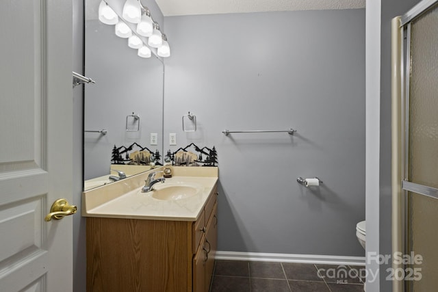 1201 Deermouse Way, Hendersonville, NC 28792 - bathroom with a shower with shower door, toilet, baseboards, tile patterned flooring, and vanity