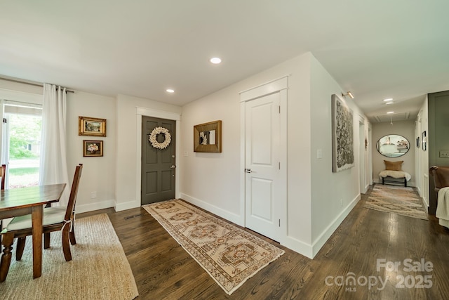entrance foyer with visible vents, baseboards, recessed lighting, and dark wood finished floors