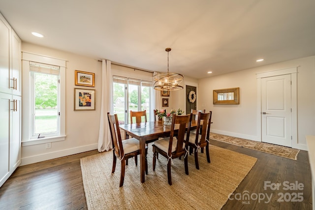 dining room featuring recessed lighting, dark wood finished floors, baseboards, and a notable chandelier