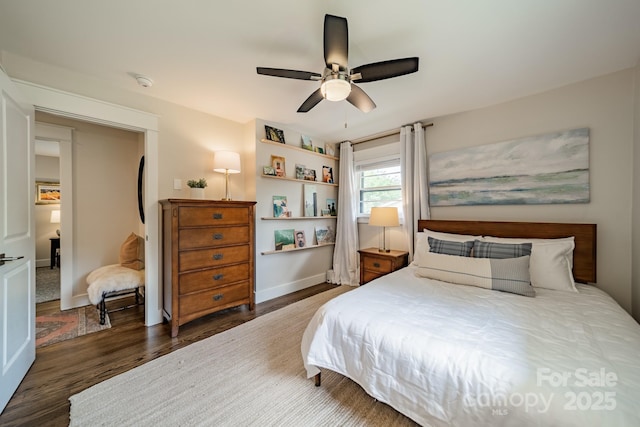 bedroom with wood finished floors, baseboards, and ceiling fan