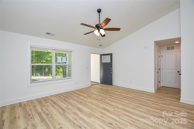 spare room with baseboards, ceiling fan, light wood-style flooring, and visible vents