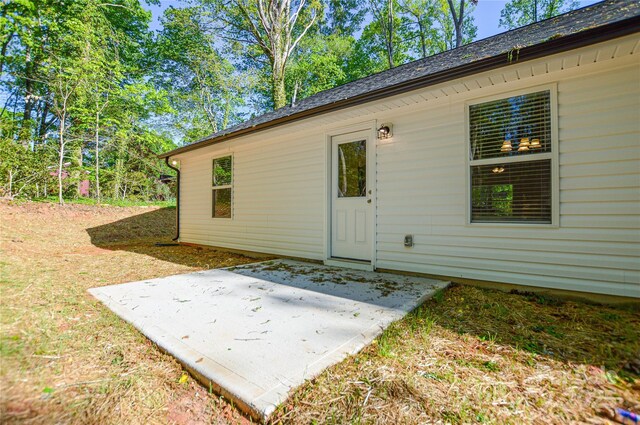 back of house with a patio area