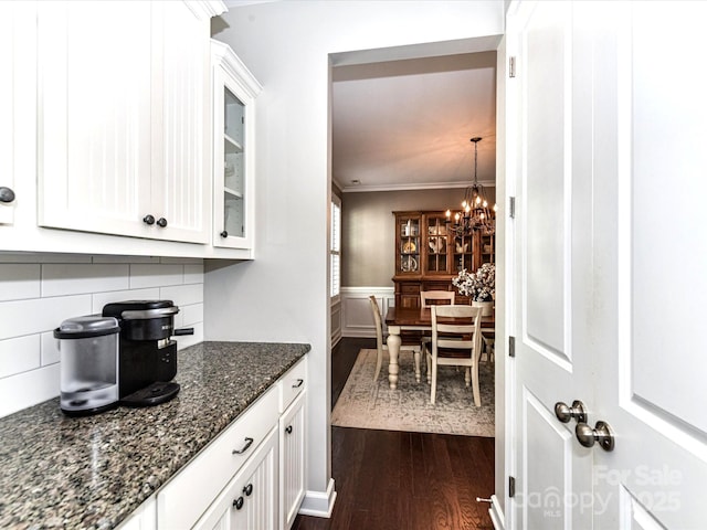 3057 Drummond Ave, Indian Land, SC 29707 - bar with ornamental molding, wainscoting, dark wood-style floors, a chandelier, and tasteful backsplash