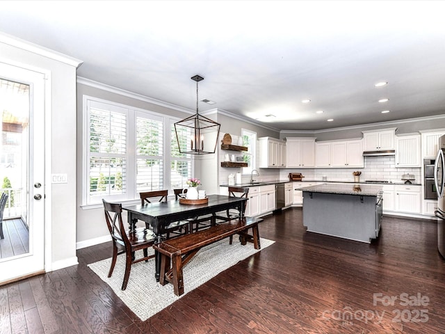 3057 Drummond Ave, Indian Land, SC 29707 - dining space featuring crown molding, dark wood-style flooring, a notable chandelier, recessed lighting, and baseboards
