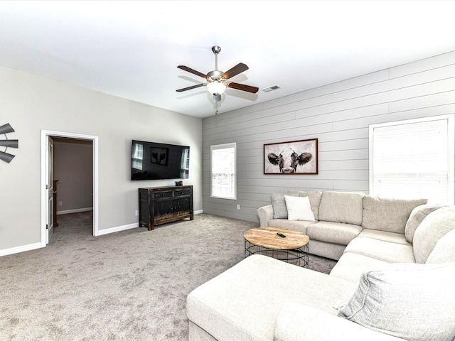 3057 Drummond Ave, Indian Land, SC 29707 - living room with a ceiling fan, visible vents, baseboards, wooden walls, and carpet