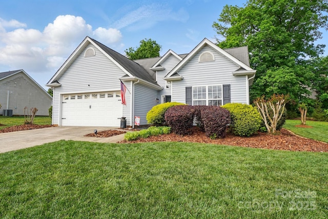view of front facade featuring a garage, a front lawn, and driveway