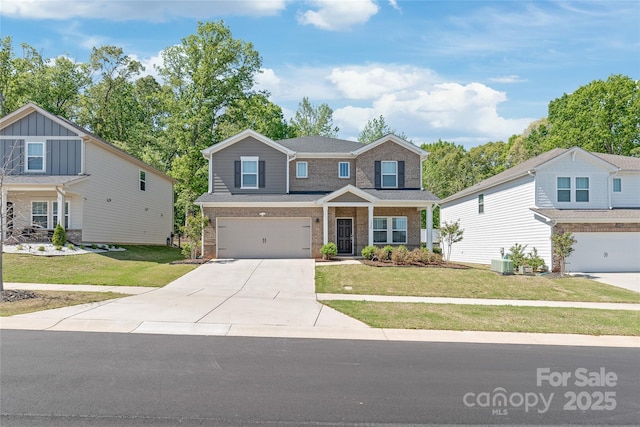 1020 Clementine Rd, Monroe, NC 28110 - craftsman-style house with an attached garage, driveway, brick siding, and a front yard