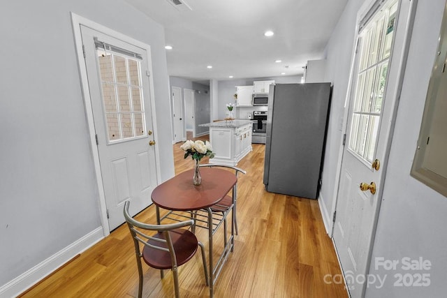 4009 Dunwoody Dr, Charlotte, NC 28215 - dining space with light wood-style floors, baseboards, and recessed lighting