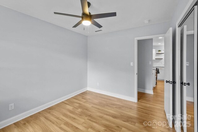 4009 Dunwoody Dr, Charlotte, NC 28215 - unfurnished room featuring ceiling fan, light wood-style floors, and baseboards