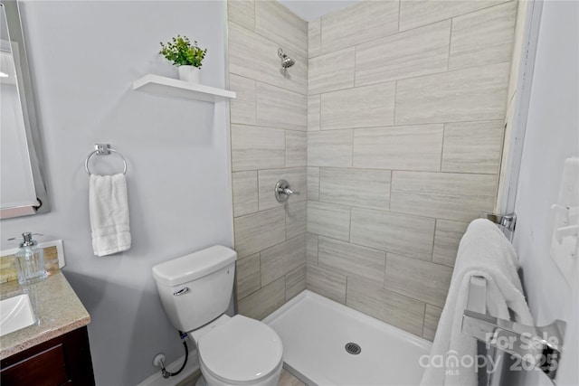 4009 Dunwoody Dr, Charlotte, NC 28215 - bathroom featuring toilet, a tile shower, and vanity