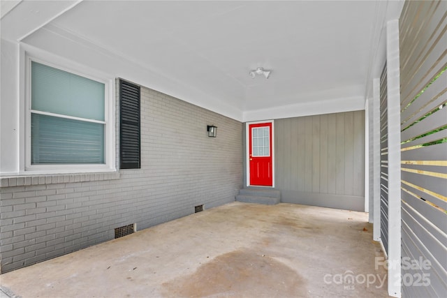 4009 Dunwoody Dr, Charlotte, NC 28215 - doorway to property with brick siding, crawl space, and a patio