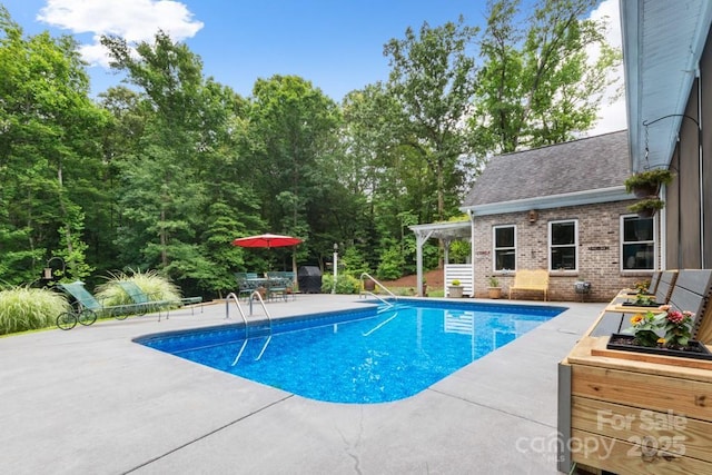 pool with a patio area