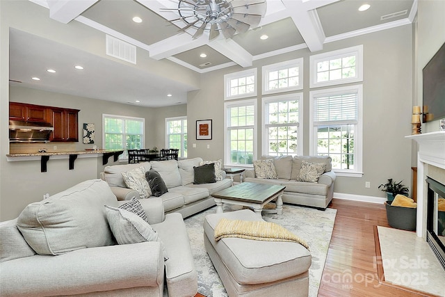 1105 Hoyle Ln, Waxhaw, NC 28173 - living area featuring light wood-type flooring, visible vents, recessed lighting, coffered ceiling, and a ceiling fan
