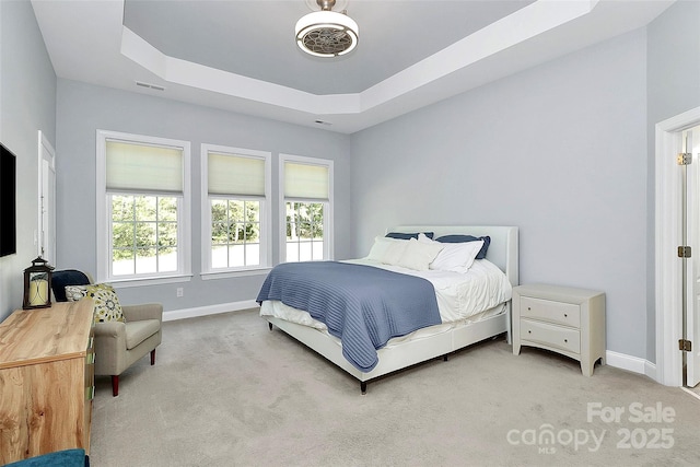 1105 Hoyle Ln, Waxhaw, NC 28173 - carpeted bedroom featuring visible vents, baseboards, and a tray ceiling