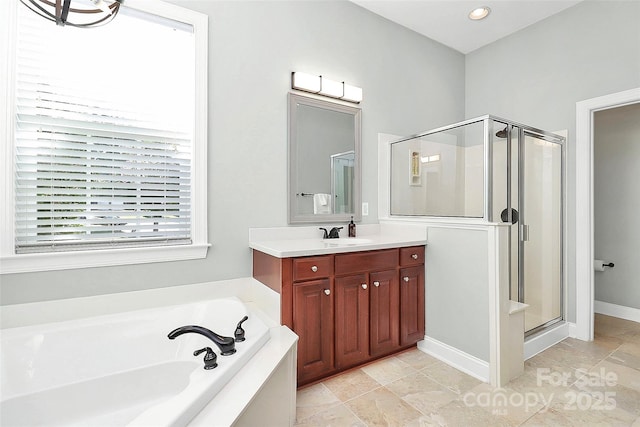 1105 Hoyle Ln, Waxhaw, NC 28173 - full bathroom with a bath, vanity, recessed lighting, and a shower stall