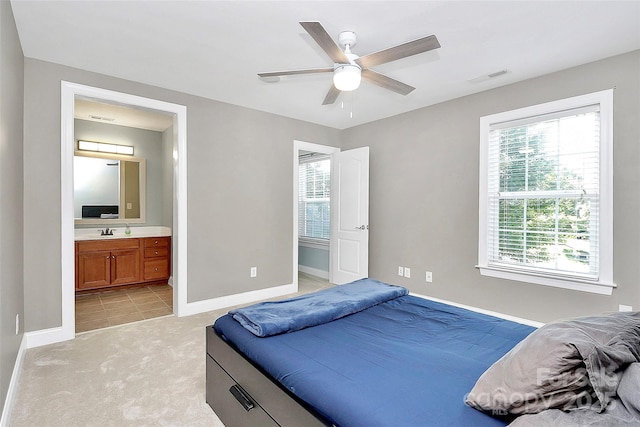 1105 Hoyle Ln, Waxhaw, NC 28173 - bedroom featuring a sink, light carpet, baseboards, ensuite bath, and visible vents