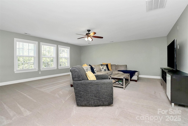 1105 Hoyle Ln, Waxhaw, NC 28173 - living room with visible vents, a ceiling fan, baseboards, and light carpet