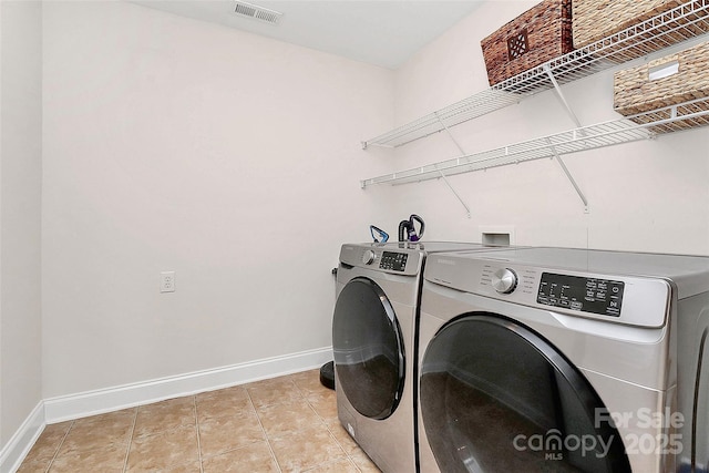 1105 Hoyle Ln, Waxhaw, NC 28173 - washroom featuring baseboards, visible vents, separate washer and dryer, and laundry area