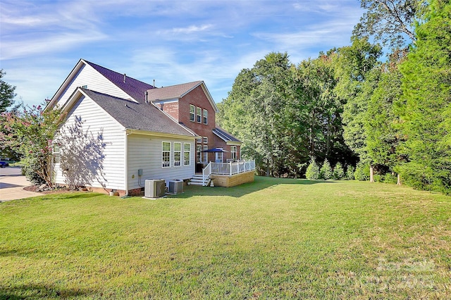 1105 Hoyle Ln, Waxhaw, NC 28173 - back of property featuring a wooden deck, central air condition unit, a lawn, and a shingled roof