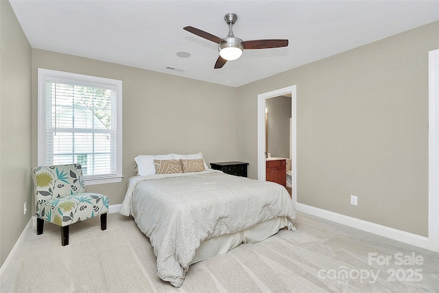 1105 Hoyle Ln, Waxhaw, NC 28173 - bedroom with visible vents, connected bathroom, baseboards, light colored carpet, and ceiling fan