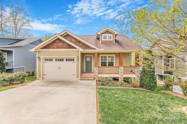 30 Asher Ln, Arden, NC 28704 - craftsman-style house featuring concrete driveway, a front yard, a porch, and a garage