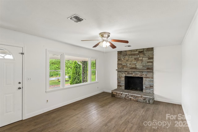 unfurnished living room with ceiling fan, baseboards, wood finished floors, and visible vents