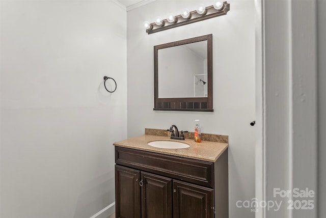 bathroom with vanity and ornamental molding