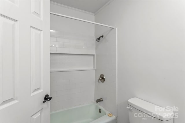 full bathroom featuring shower / washtub combination, crown molding, and toilet
