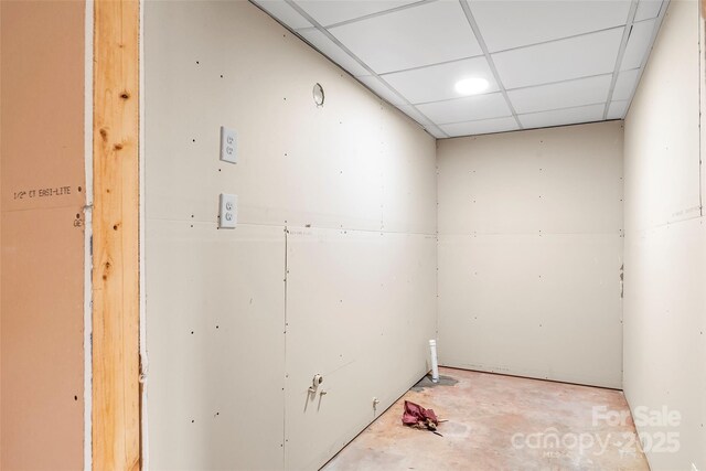interior space with a paneled ceiling