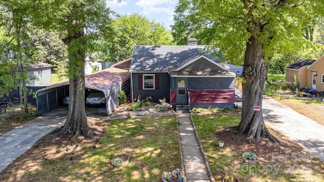3919 Sarah Dr Unit 14, Charlotte, NC 28217 - bungalow with a detached carport, a chimney, and driveway