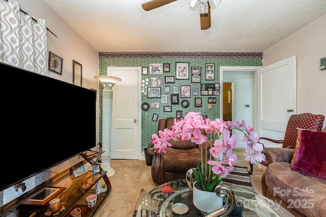 3919 Sarah Dr Unit 14, Charlotte, NC 28217 - living room featuring light colored carpet, a ceiling fan, a textured ceiling, and wallpapered walls