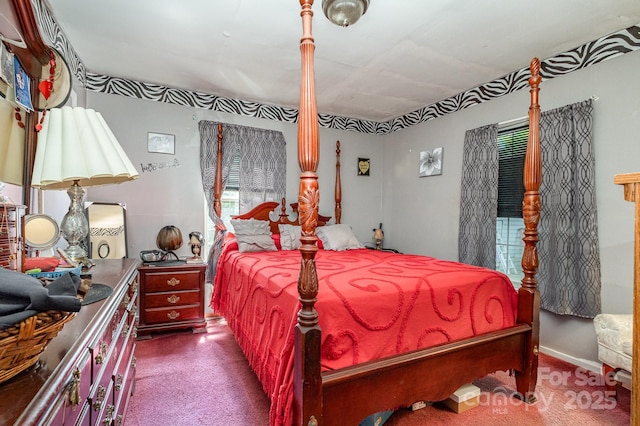 3919 Sarah Dr Unit 14, Charlotte, NC 28217 - carpeted bedroom featuring multiple windows
