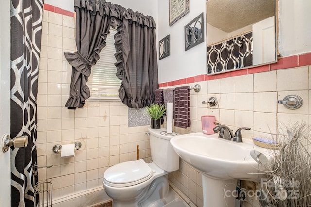 3919 Sarah Dr Unit 14, Charlotte, NC 28217 - bathroom featuring tile walls and toilet