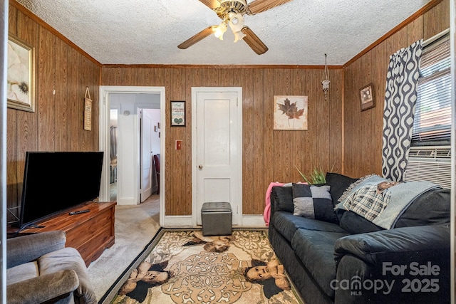 3919 Sarah Dr Unit 14, Charlotte, NC 28217 - living area featuring light colored carpet, ceiling fan, crown molding, and wooden walls