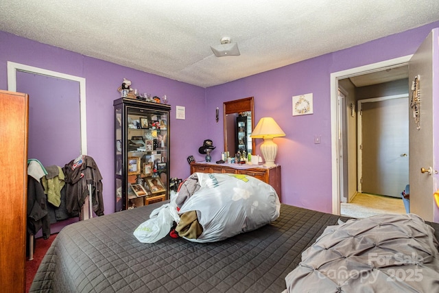 3919 Sarah Dr Unit 14, Charlotte, NC 28217 - carpeted bedroom with a textured ceiling