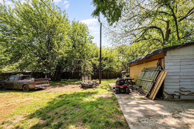 3919 Sarah Dr Unit 14, Charlotte, NC 28217 - view of yard with fence and an outdoor fire pit