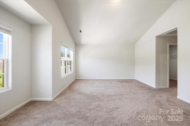 bonus room with visible vents, vaulted ceiling, baseboards, and carpet floors